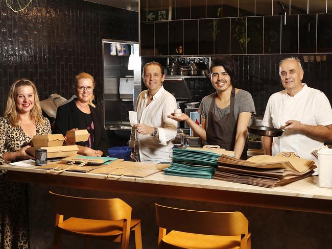 Fleur Sharpe (Cook Live Love), Claire Parviz (Spaghetti House), Javier Codina (Moda), Josh Lopez (The Wolfe) and Philip Johnson (E’cco Bistro) are banding together to feed medical workers amid the coronavirus pandemic. Picture: Josh Woning/AAP