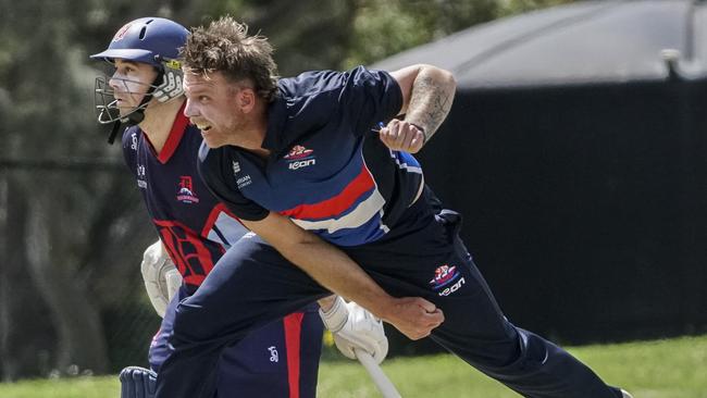 Brett Forsyth watches on as Footscray quick Jake Reed delivers. Picture: Valeriu Campan