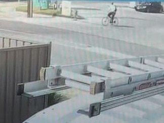 CCTV footage from a property across the road from the West Beach service station shows the alleged thief cycling away at a leisurely pace. . Picture: Supplied