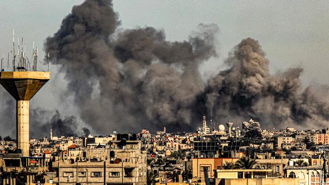 Smoke billows from Israeli bombardment over Khan Yunis from Rafah in the southern Gaza Strip on December 16. Picture: AFP