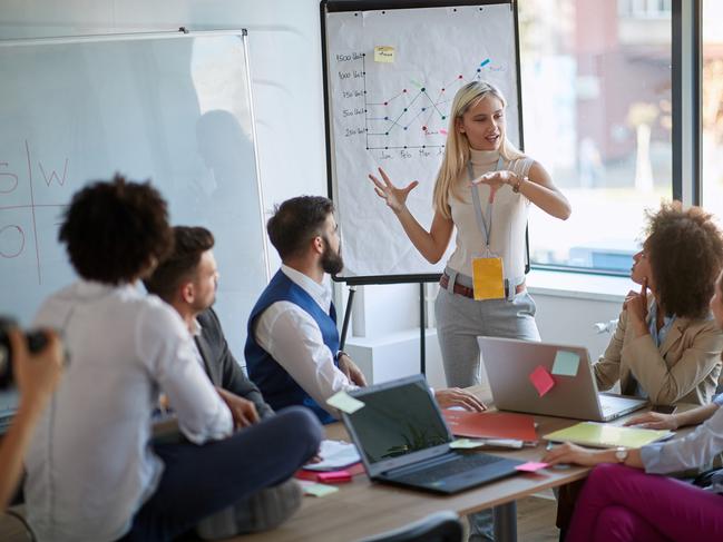 Gender balance - Business woman present her idea to working team.Business colleagues talking about plan or new project.