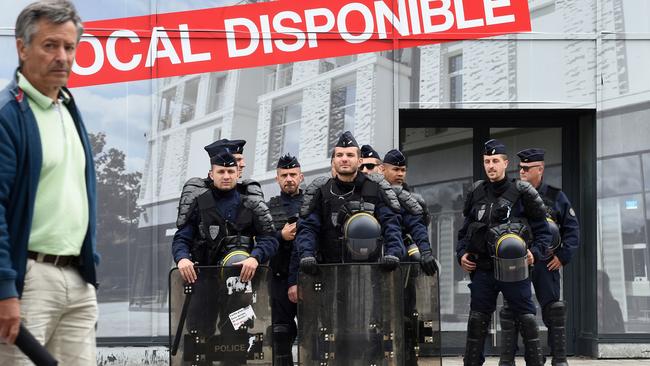 Riot policemen stand together during a Black Lives Matter rally in Nantes, western France.