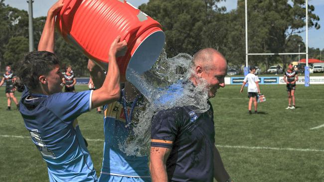 Coach Shaun Davison gets splashed in the Andrew Johns Cup grand final featuring Macarthur Wests Tigers and the Northern Rivers Titans on April 3 last year. The Titans nabbed 24 points and the Tigers, 22. Picture: Bryden Sharp