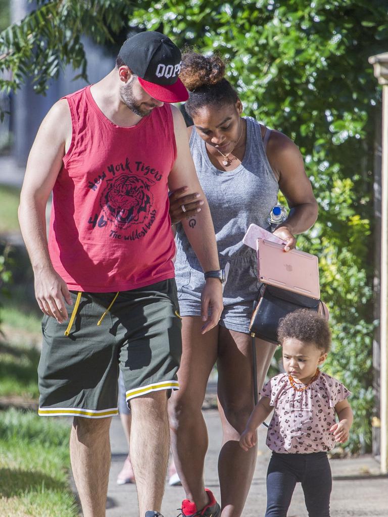 Serena Williams and her husband Alexis Ohanian enjoy an afternoon walk with their 1-year-old daughter Alexia Olympia. Serena's daughter looked seriously cute, toddling her way down the footpath, wearing Nike sneakers like her Mummy. Picture: MediaMode