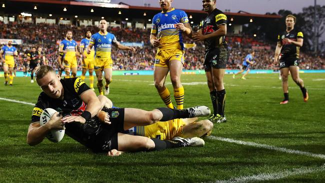 Bryce Cartwright scores a try against the Eels.