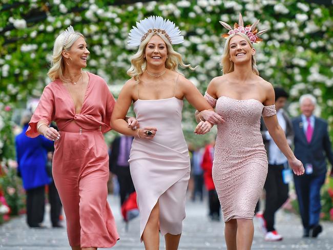 Sisters Chrissy Thomas, Amy-Lee and Kirsty Seward arrive at Melbourne’s Flemington Racecourse for the 2017 Melbourne Cup. Picture: Jason Edwards