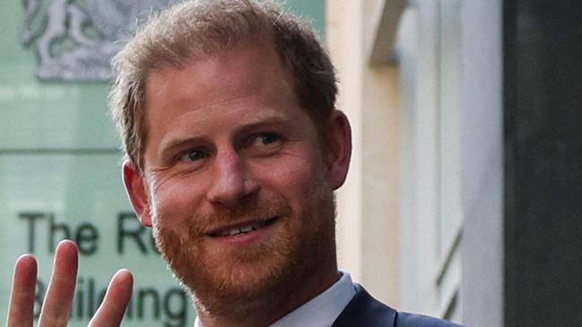 (FILES) Britain's Prince Harry, Duke of Sussex, waves as he leaves the Royal Courts of Justice, Britain's High Court, in central London on June 7, 2023. Prince Harry has dropped his defamation proceedings against the publishing company of the British tabloid Mail on Sunday, which he had attacked over an article relating to his police protection when he visits the United Kingdom, the publication announced on Friday, January 19. (Photo by Adrian DENNIS / AFP)