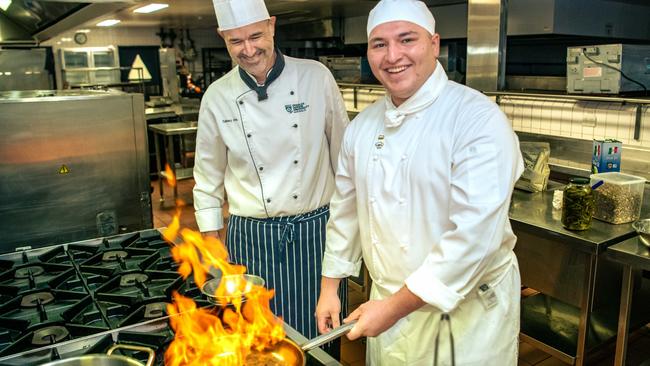 CDU Certificate III Commercial Cookery Student Stellio Ginis (right) has been selected for the 2024 Culinary Olympics in Germany. He took up cooking after deciding his previous job as a roofer wasn't for him. Picture: Adnan Reza