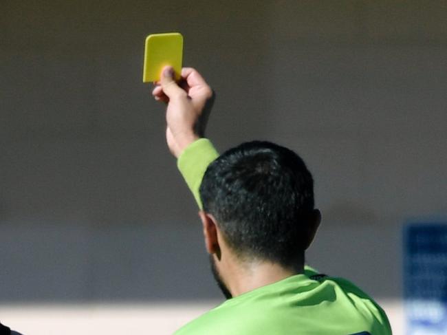 Ryan Spittle reacts while getting yellow-carded by an umpire during the Goodwood Saints versus Tea Tree Gully game in Adelaide, Saturday, April 21, 2018.  (AAP Image/Morgan Sette)