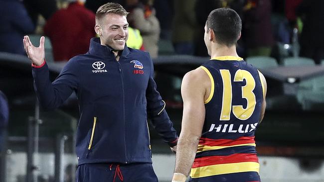 Daniel Talia celebrates Adelaide’s win over Geelong with Taylor Walker. Picture: Sarah Reed