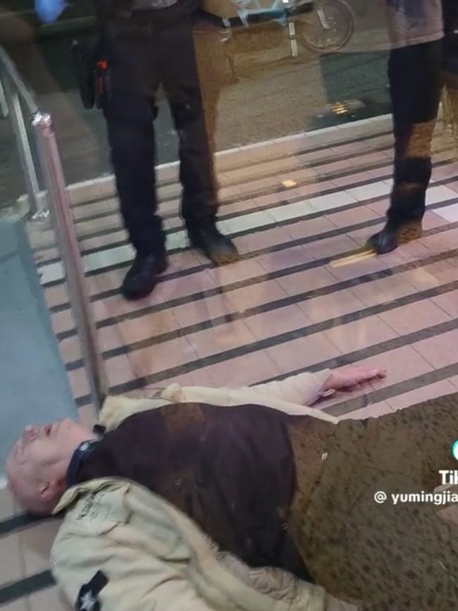 After the ordeal, the man was filmed lying on the floor. Picture: TikTok