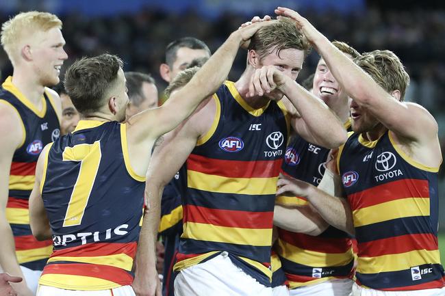 Adelaide Crows players congratulate Alex Keath for being named the Showdown medalist at Adelaide Oval. Picture Sarah Reed