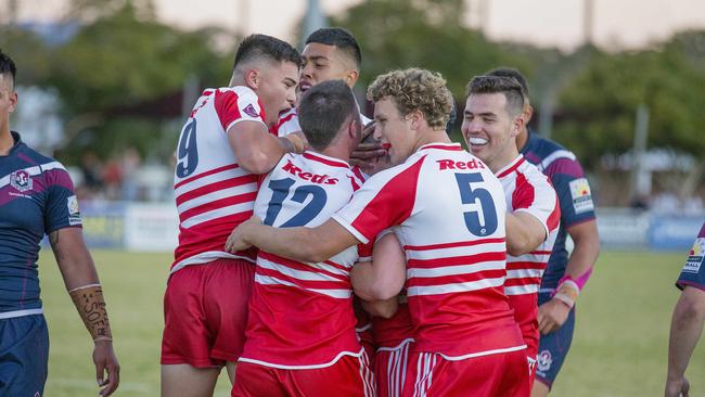 Palm Beach Currumbin's Tom Weaver is engulfed by teammates . Picture: Jerad Williams