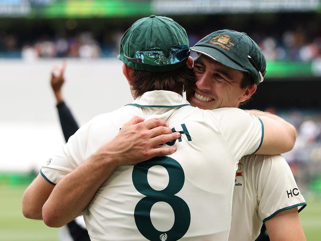 Pat Cummins embraces Mitch Marsh after the win in Melbourne. Picture: Robert Cianflone/Getty Images