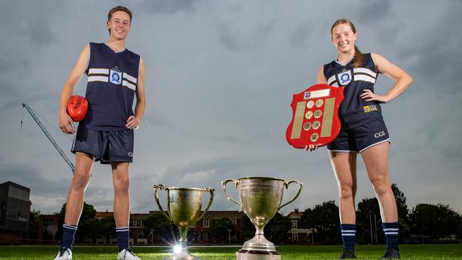 Ollie Murphy and Annabelle Embelton, Photo of a leading Caulfield boy and girl footballer in full footy gear posing for a photo with footy in hand and maybe the premiership trophies they won last year. Photo is for a school footy preview story to go in the Local Footy liftout in early April.