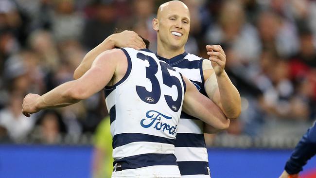 Patrick Dangerfield gets a hug from Gary Ablett. Picture: Michael Klein