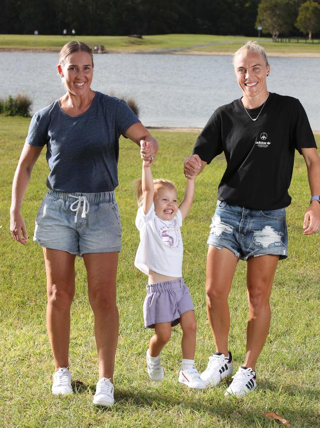 Tameka and Kirsty Yallop with daughter Harley on the Gold Coast. Picture Glenn Hampson