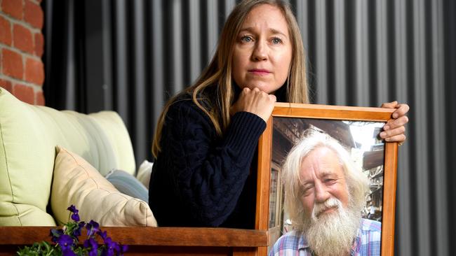 Never forgotten. Jasmine Berry with a portrait of her father Ron Selth who died as a result of the Cudlee Creek fire. Picture: Tricia Watkinson