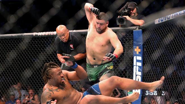 Tai Tuivasa (top) takes down Greg Hardy in the first round in their heavyweight bout during UFC 264. Picture: Getty Images