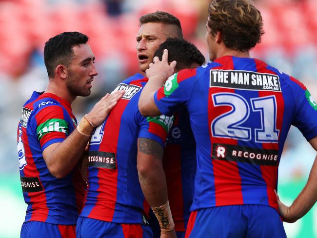 Newcastle's Dane Gagai is consoled by teammates after the Knights huge loss to the Sharks at Hunter Stadium. Picture. Phil Hillyard