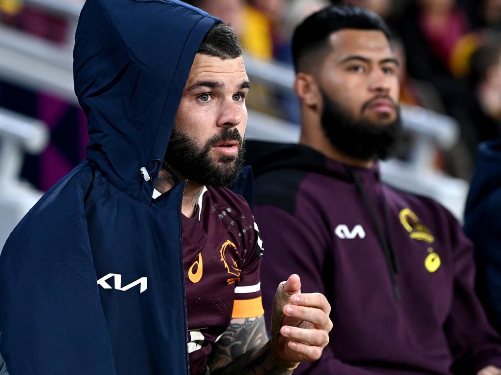Adam Reynolds and Payne Haas on the Broncos bench after being injured against the Raiders. Picture: Bradley Kanaris/Getty Images