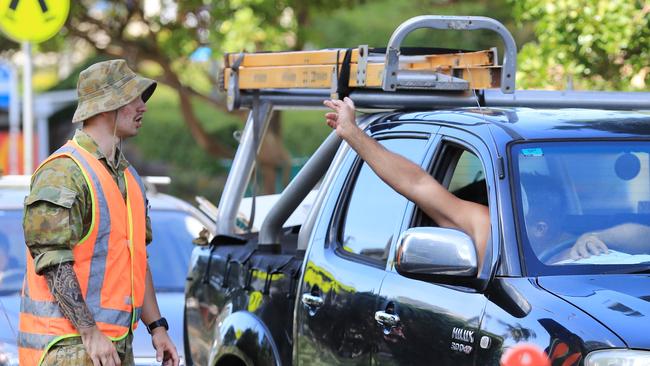 Drivers attempting to enter Queensland across the NSW border at Griffith Street in Coolangatta are stopped by an Australian Army officer. Photo: Scott Powick.