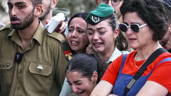 Comrades mourn Eli Valentin Ghenassia, a French-Israeli soldier who was killed in combat at Kibbutz Be'eri during the Hamas attack. His funeral was held in Jerusalem on Thursday. Picture: AFP/Getty Images