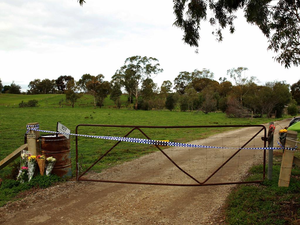 Floral tributes out the front of the Hillier property. Picture: Dean Martin