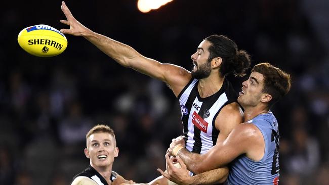 Brodie Grundy of the Magpies competes in the ruck against Scott Lycett of the Power. Picture: Quinn Rooney/Getty Images