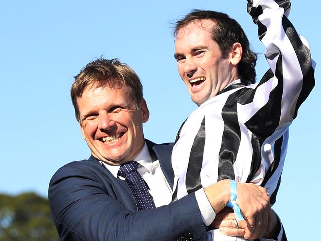 SYDNEY, AUSTRALIA - OCTOBER 26: Trainer Bjorn Baker celebrates after Tyler Schiller riding Belclare wins Race 8 The Invitation during "Spring Champion Stakes Day" Sydney Racing at Royal Randwick Racecourse on October 26, 2024 in Sydney, Australia. (Photo by Jeremy Ng/Getty Images)