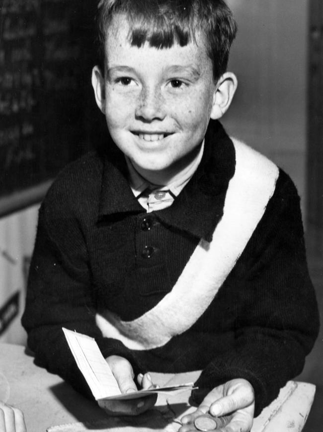 Lee Jones does his school banking at Burney State School in 1956. Picture: Argus Photo File