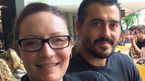 Nicole Marchment and Darren Budini are stuck at Qld/NSW border where they are waiting in limbo until Queensland Health either denies or approves a request for Mr Budini to attend his mother’s funeral.