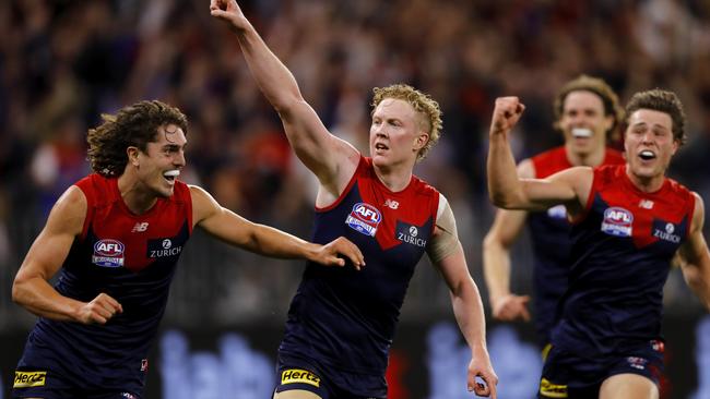 Luke Jackson, Clayton Oliver and Tom Sparrow celebrate a goal in the grand final. Picture: Dylan Burns/AFL Photos