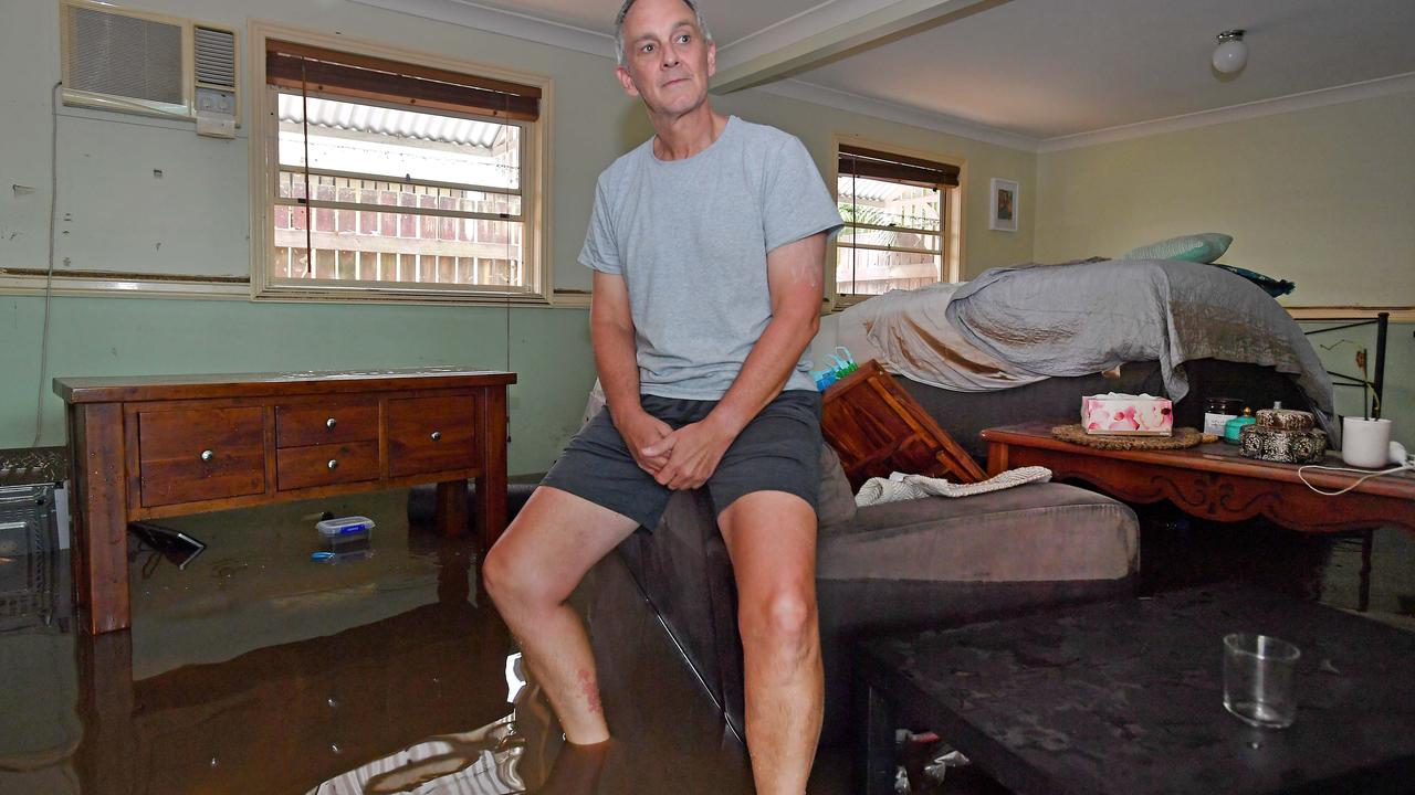 David Weller in ankle-deep water inside his Somerset St, Windsor, home on Monday. Picture: John Gass