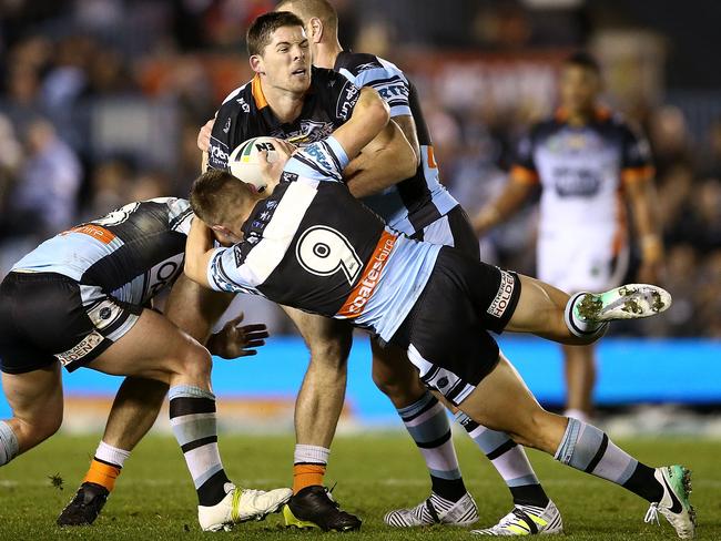 Matt Eisenhuth is tackled during his NRL debut for the Wests Tigers against Cronulla at Southern Cross Group Stadium. Picture: Getty Images