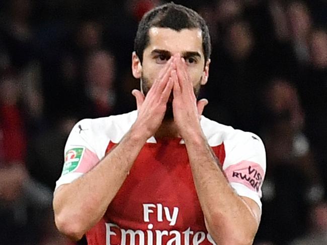 Arsenal's Armenian midfielder Henrikh Mkhitaryan reacts during the English League Cup quarter-final football match between Arsenal and Tottenham Hotspur at the Emirates Stadium in London on December 19, 2018. (Photo by Ben STANSALL / AFP) / RESTRICTED TO EDITORIAL USE. No use with unauthorized audio, video, data, fixture lists, club/league logos or 'live' services. Online in-match use limited to 120 images. An additional 40 images may be used in extra time. No video emulation. Social media in-match use limited to 120 images. An additional 40 images may be used in extra time. No use in betting publications, games or single club/league/player publications. /