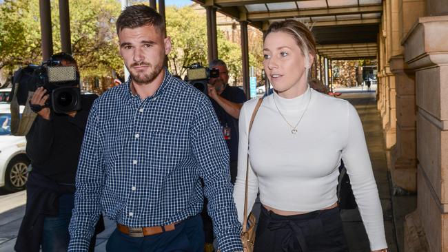 Nurse and AFLW player Deni Varnhagen leaves the District Court with her partner Jarrad Duthie. Picture: NCA NewsWire / Brenton Edwards.