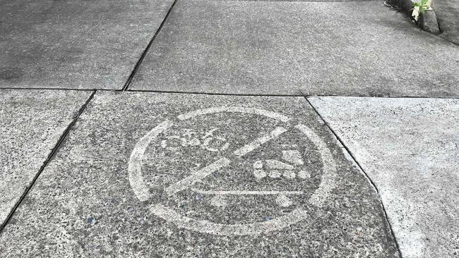 NOT ALLOWED: A sign painted on Victoria St indicated no bikes, skateboards or roller blades allowed on the footpath. Picture: Jarrard Potter