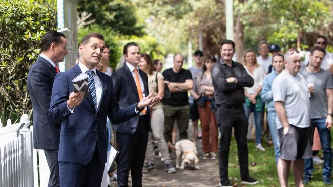 Auctioneer Paul Menck (left) calls bids at a recent Queens Park auction. Picture: Julian Andrews