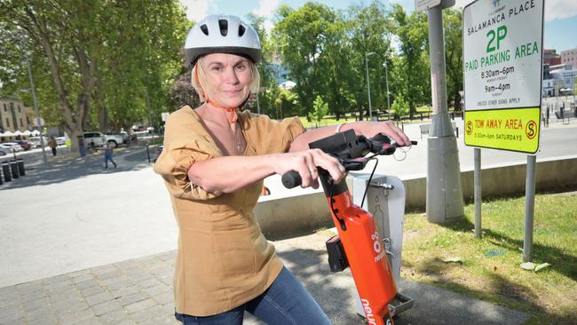 Tracey Rush tries out the new rental e-scooters. Picture: Kenji Sato