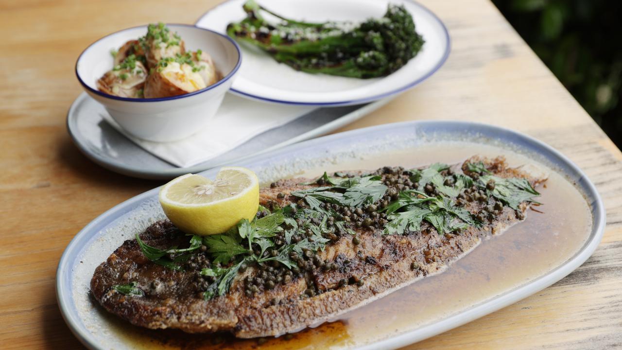 The signature sole meuniere dish with grilled broccolini and crispy kipfler potato sides at Sole Marcoola on the Sunshine Coast.