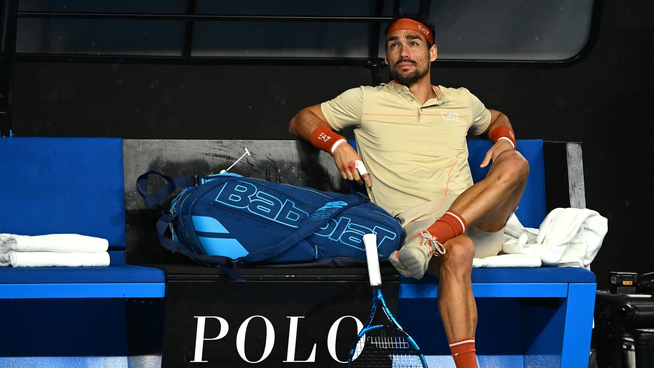 MELBOURNE, AUSTRALIA - JANUARY 17: Fabio Fognini of Italy looks on as rain delays play on KIA Arena ahead of their round one singles match against Thanasi Kokkinakis of Australia during day two of the 2023 Australian Open at Melbourne Park on January 17, 2023 in Melbourne, Australia. (Photo by Quinn Rooney/Getty Images)