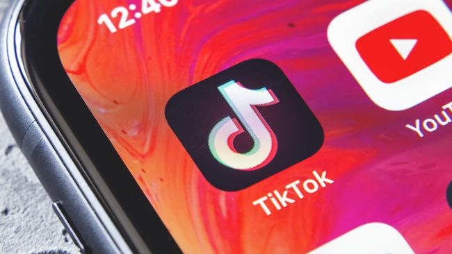 TikTok and YouTube apps on screen iphone xr, close up