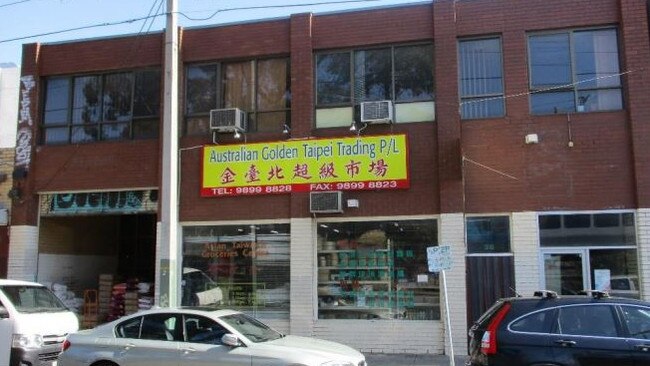 A double-storey brick building stands at 38 Rutland Rd, Box Hill.