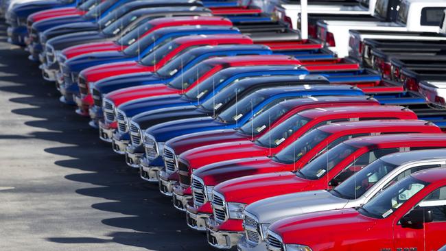 FILE - In this Monday, Jan. 5, 2015, file photo, Dodge Ram pickup trucks are on display on the lot at Landmark Dodge Chrysler Jeep Ram, in Morrow, Ga. Fiat Chrysler announced, Tuesday, Oct. 27, 2015, that it’s recalling more than 88,000 Ram pickups mainly in North America because the rear axle shafts could break and cause a wheel to separate. Most of the 2015 and 2016 Rams are still at dealers. (AP Photo/John Bazemore, File)