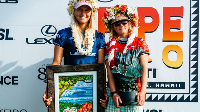 Caitlin Simmers of the United States and Molly Picklum of Australia after the Final of the Lexus Pipe Pro. Picture: Tony Heff/World Surf League.