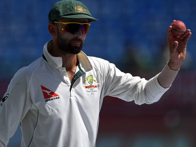 Australia's Nathan Lyon shows the ball to spectators as he celebrates his five wicket haul in India's first innings during the third day of the fourth and last Test cricket match between India and Australia at The Himachal Pradesh Cricket Association Stadium in Dharamsala on March 27, 2017. ----IMAGE RESTRICTED TO EDITORIAL USE - STRICTLY NO COMMERCIAL USE----- / GETTYOUT---- / AFP PHOTO / PRAKASH SINGH / ----IMAGE RESTRICTED TO EDITORIAL USE - STRICTLY NO COMMERCIAL USE----- / GETTYOUT