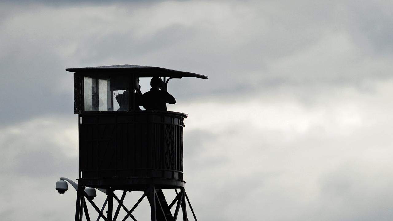 Derby Day. Flemington. Stewards watch from the clock tower during race 3.