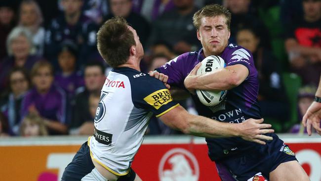NRL Preliminary Final — Melbourne Storm v North Queensland Cowboys at AAMI Park, Cameron Munster tackled by Michael Morgan. 26th September 2015. Picture: Colleen Petch.
