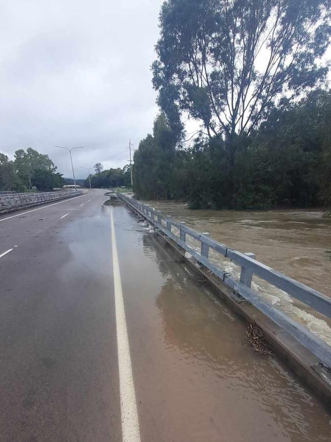 Bohle River over one side of the bridge, road closed heading outbound to Hervey Range. Picture: Shae Beplate